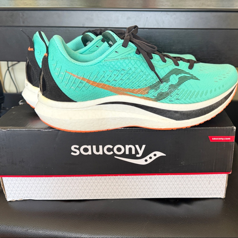 Saucony Mint Green Running Shoes with Orange Accent